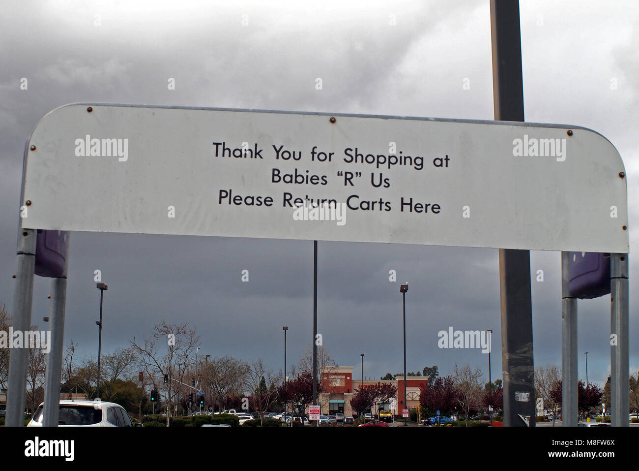 Babies R Us store, return carts sign in parking lot. Union City, California, USA Stock Photo