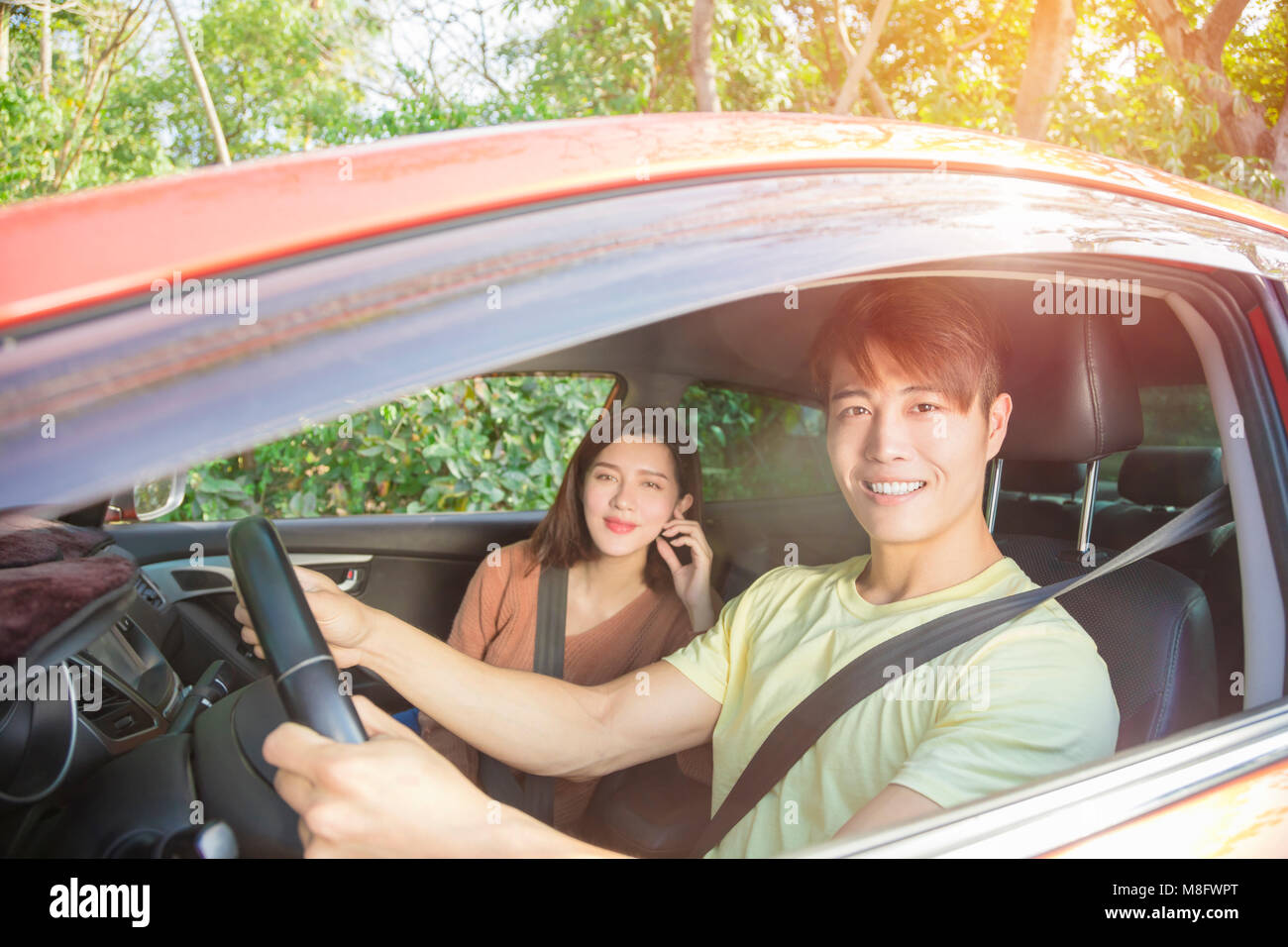happy young couple sitting in the car Stock Photo