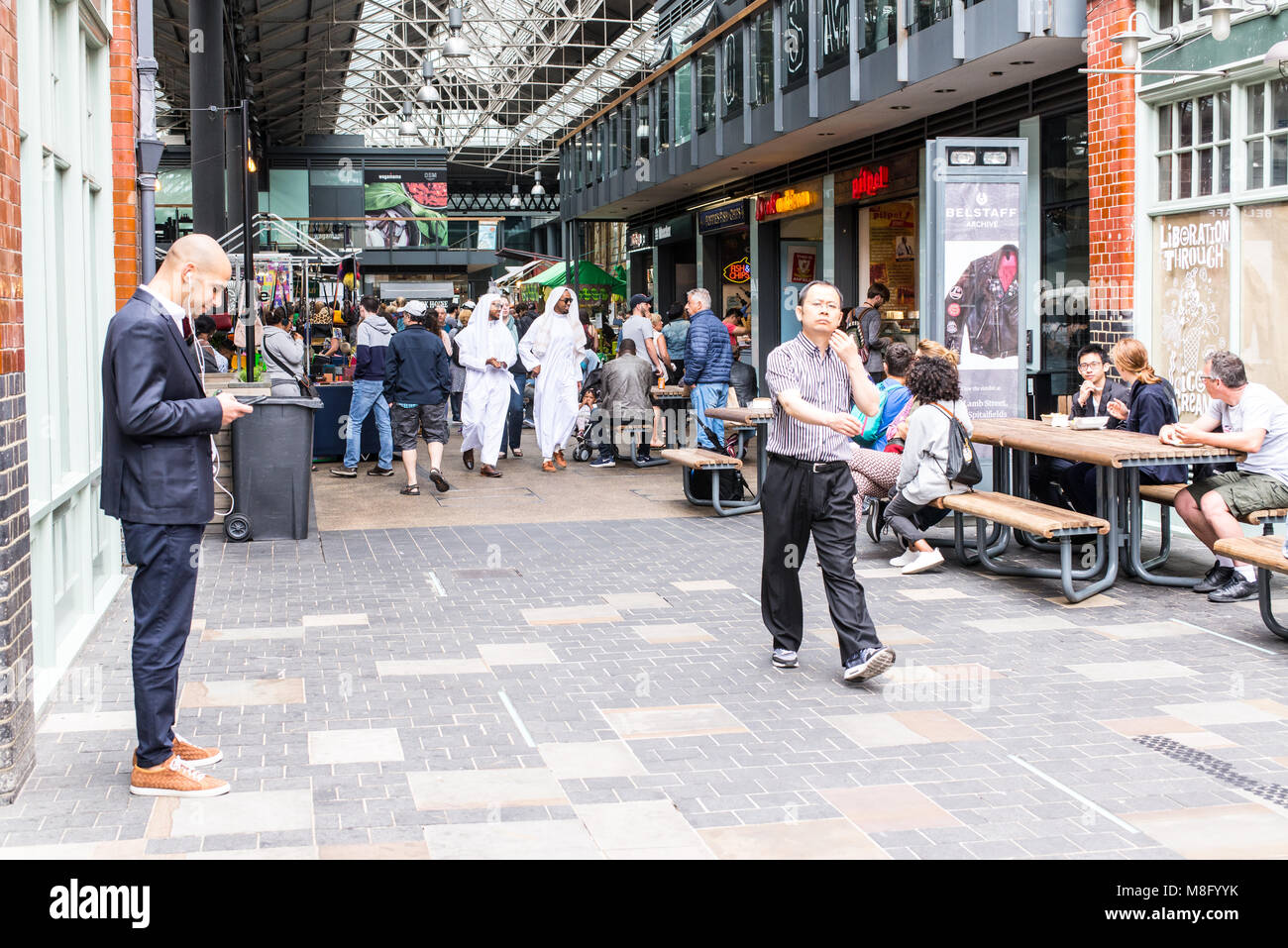 People shopping and walking around the cafes and restaurants in Old