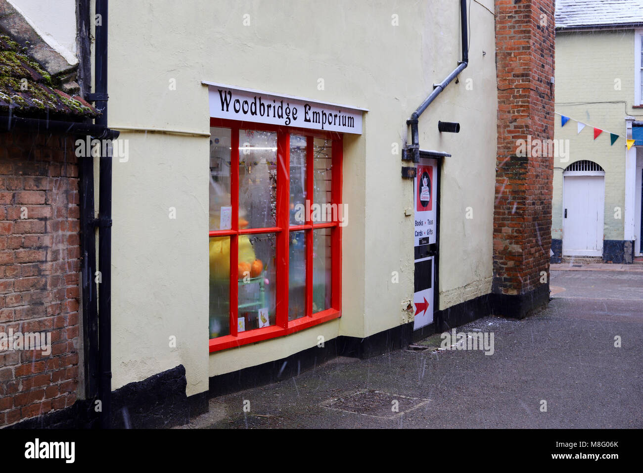 Red framed window to Woodbridge Emporium on the Thoroughfare. Woodbridge, Suffolk. Winter. March 2018. Stock Photo