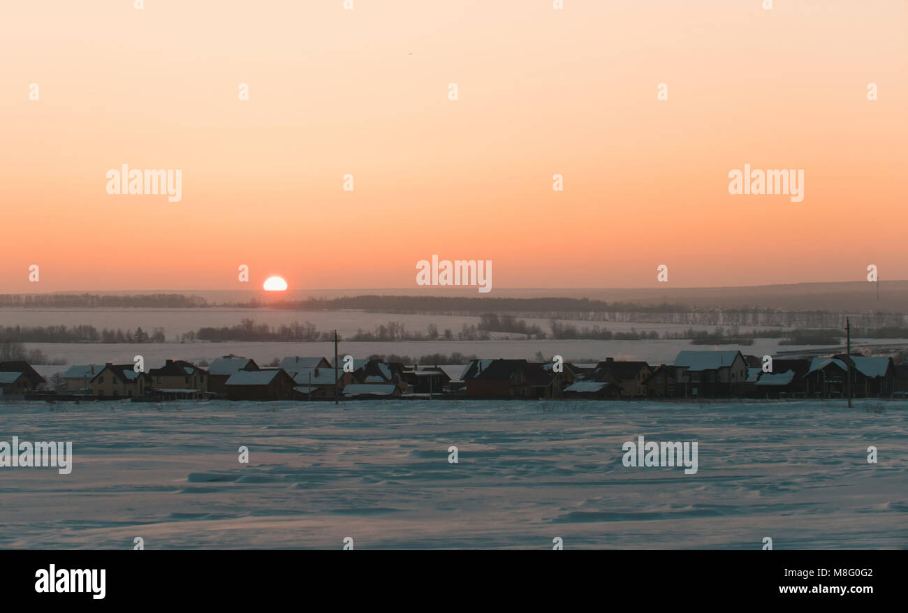 Sunrise Over Frozen snow-covered Russian rustic landscape Stock Photo ...