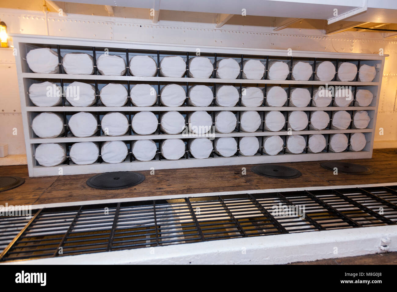 Storage for sailors' kit bags / kitbags with each bag containing belongings of a seaman, on lower deck of HMS Warrior. Portsmouth Historic Dockyard UK Stock Photo