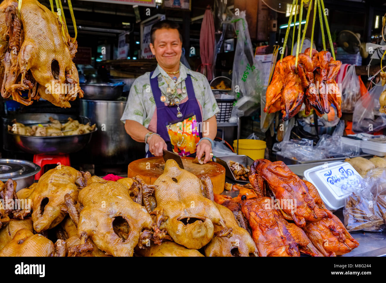 A man is selling fried ducks at Nonthaburi Market Stock Photo - Alamy