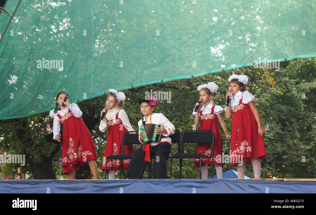 Mstyora,Russia-August 16,2014: Children in national suit sing on scene at day of the city Stock Photo