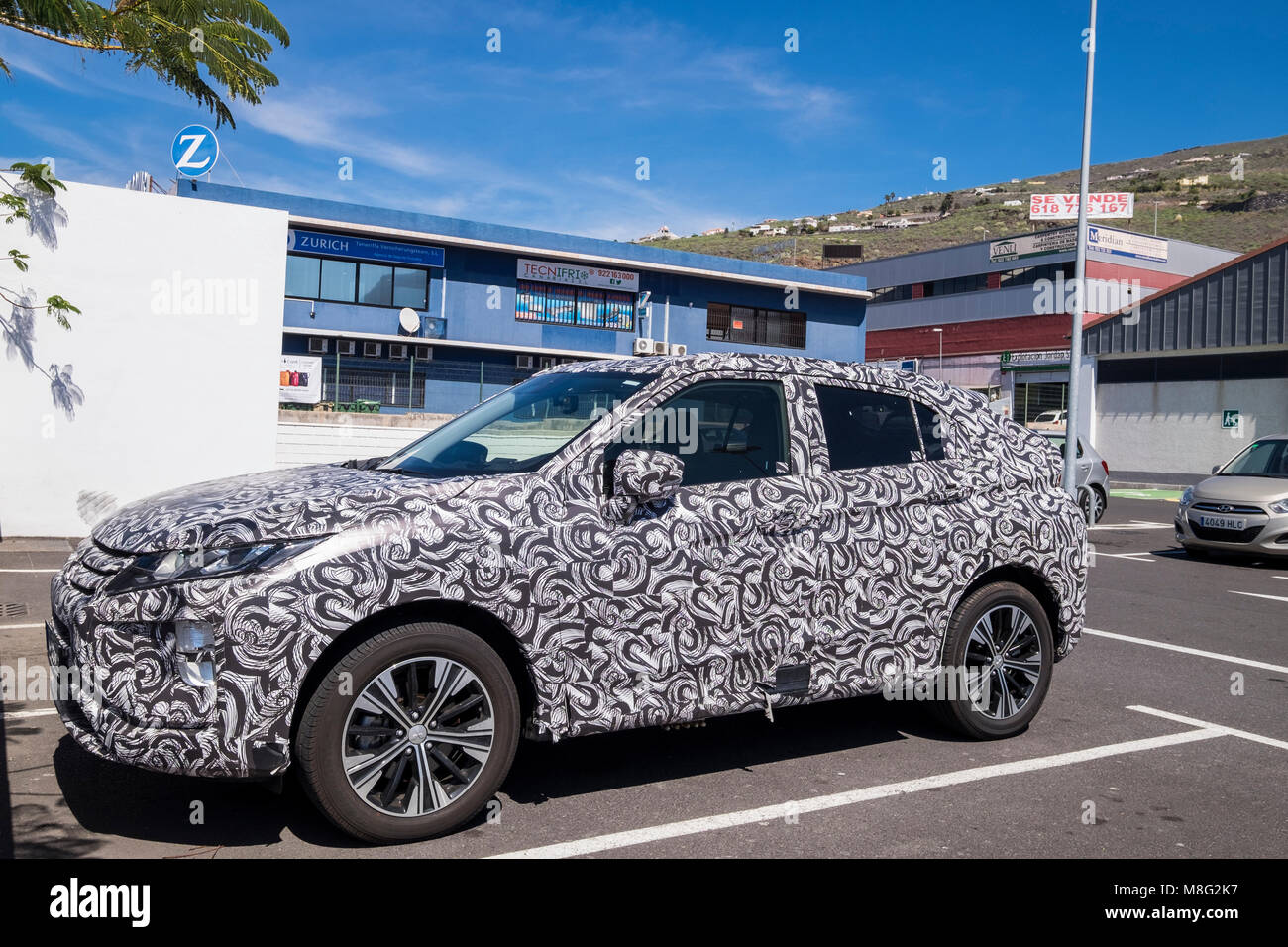 Mitsubishi Eclipse Cross SUV in confusing camoflauge wrap Stock Photo