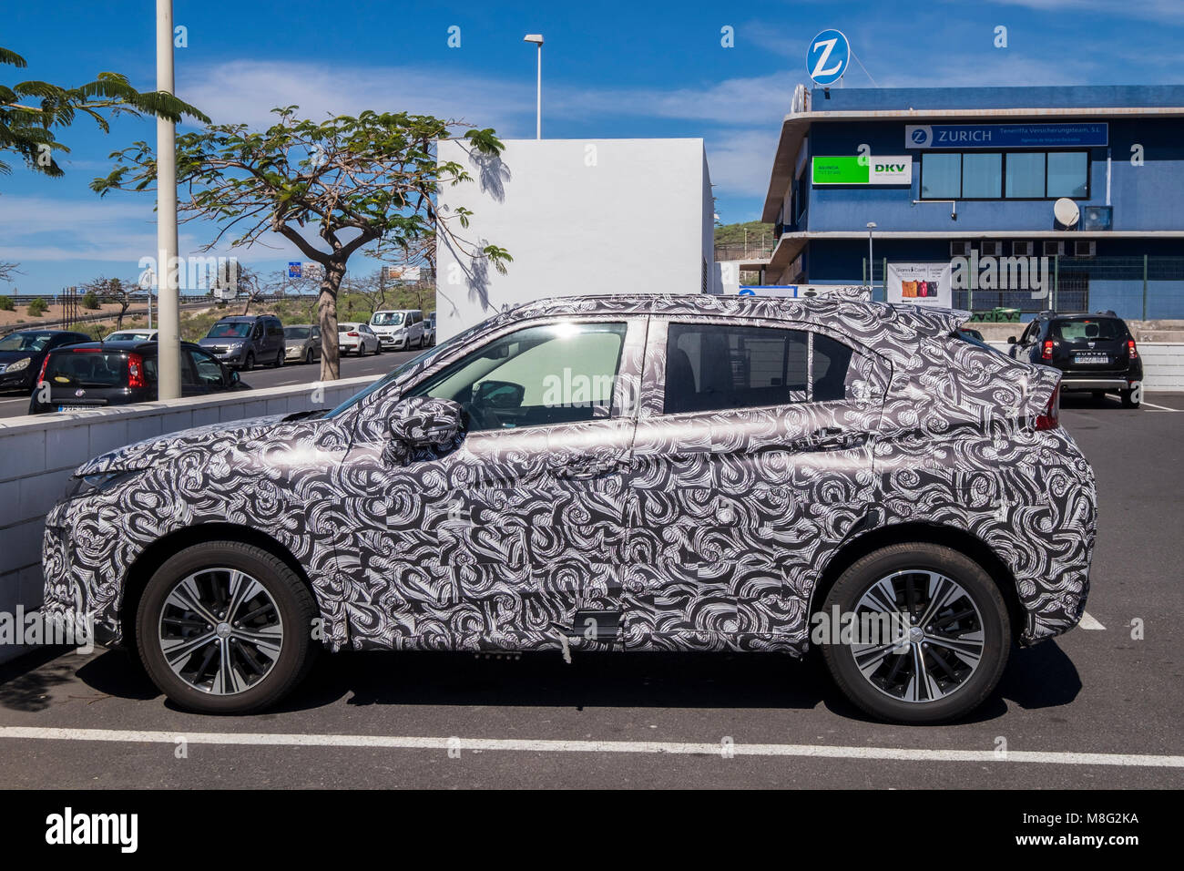 Mitsubishi Eclipse Cross SUV in confusing camoflauge wrap Stock Photo