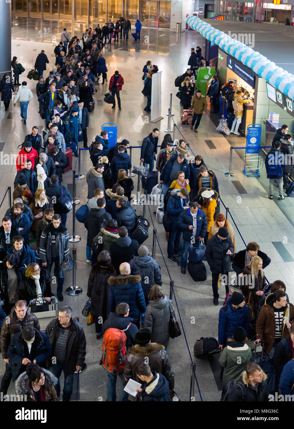 Moscow, Russia - December 30, 2015:  Many people standing in a queue to register at Vnukovo, Moscow Stock Photo