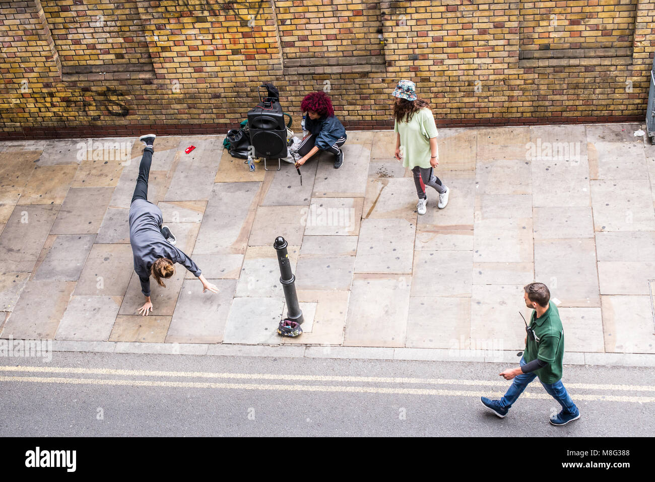 Street dance improvised performance by hip-hop acrobatic dancers and ...