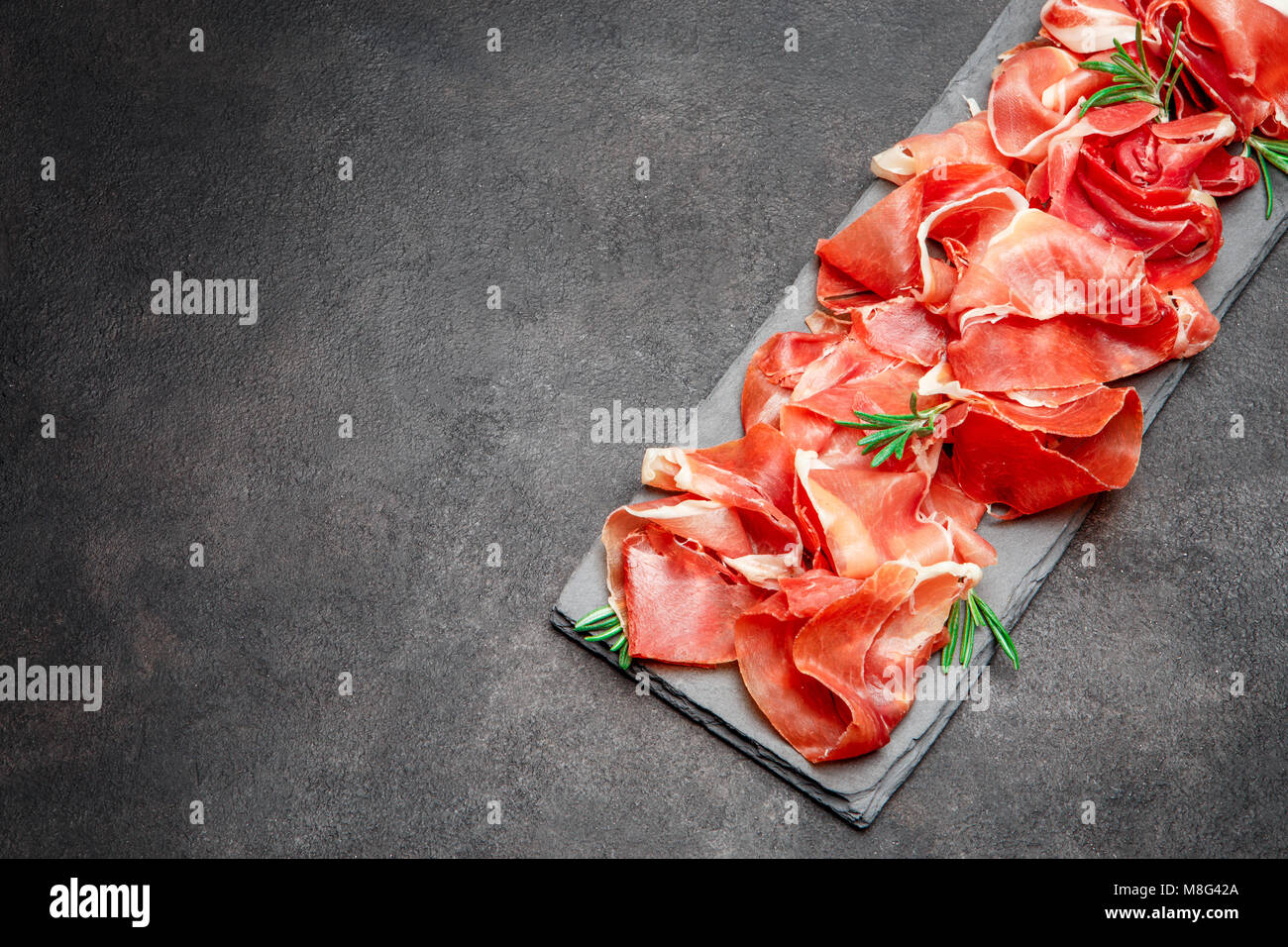 Italian prosciutto crudo or spanish jamon Stock Photo Alamy