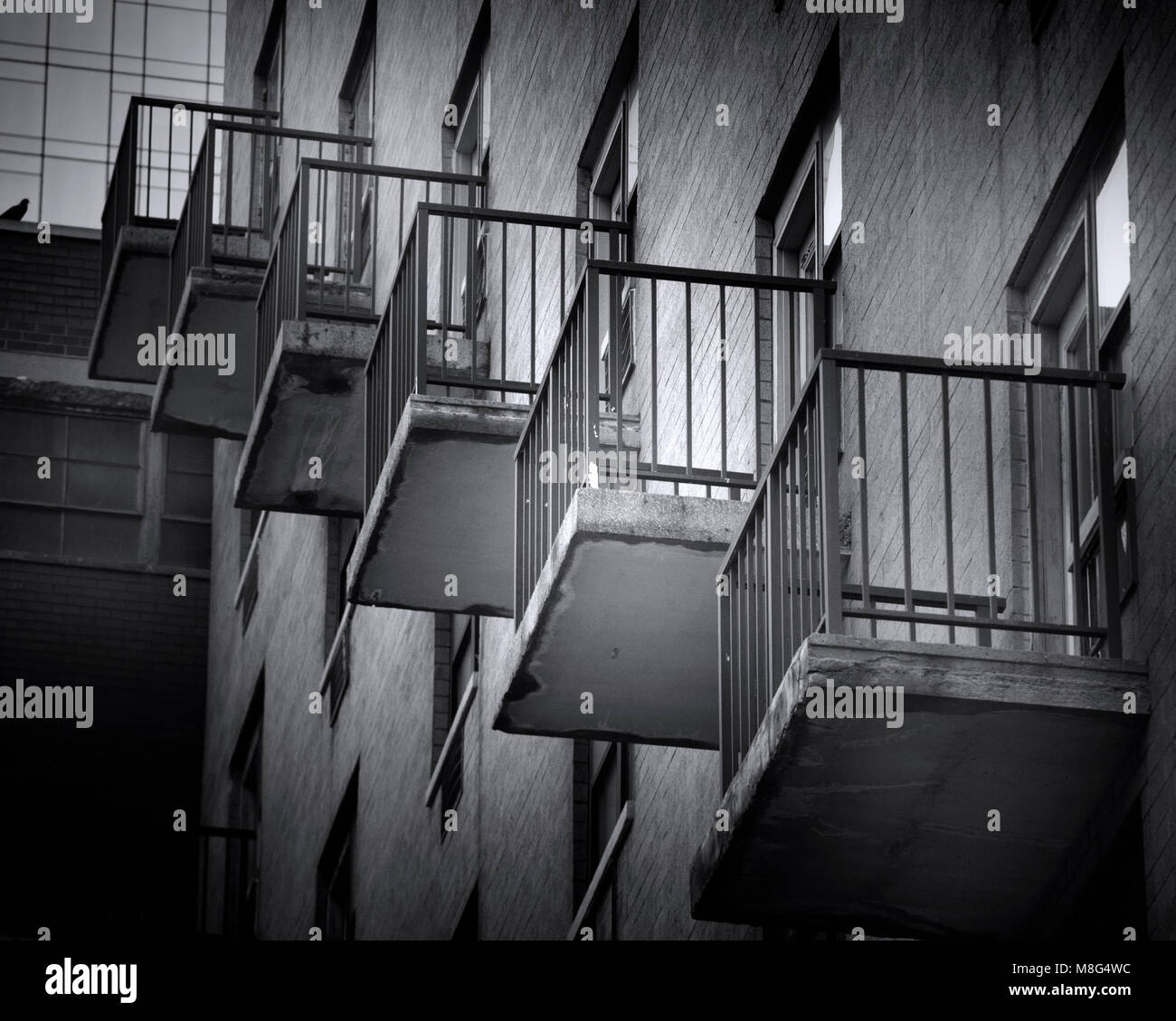 The balconies of a New York City apartment building create an interesting image when photographed from the street. Stock Photo