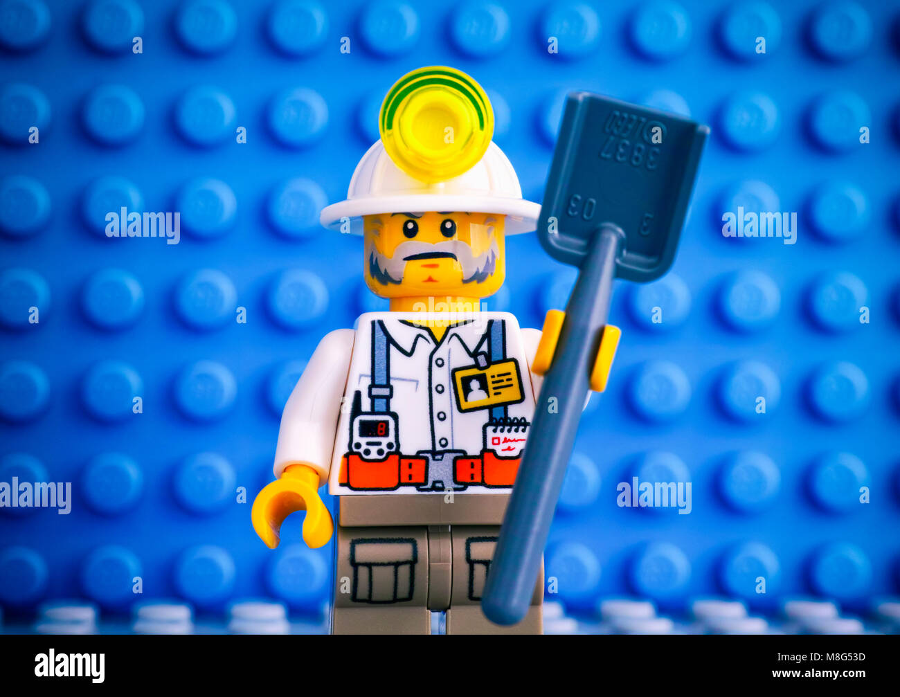 Tambov, Russian Federation - March 09, 2018 Lego miner with shovel against  blue baseplate background Stock Photo - Alamy