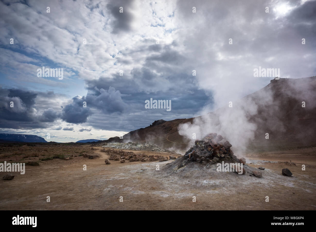 Hissing chimney in large geothermal field of Hverir during a cloudy day in Iceland Stock Photo