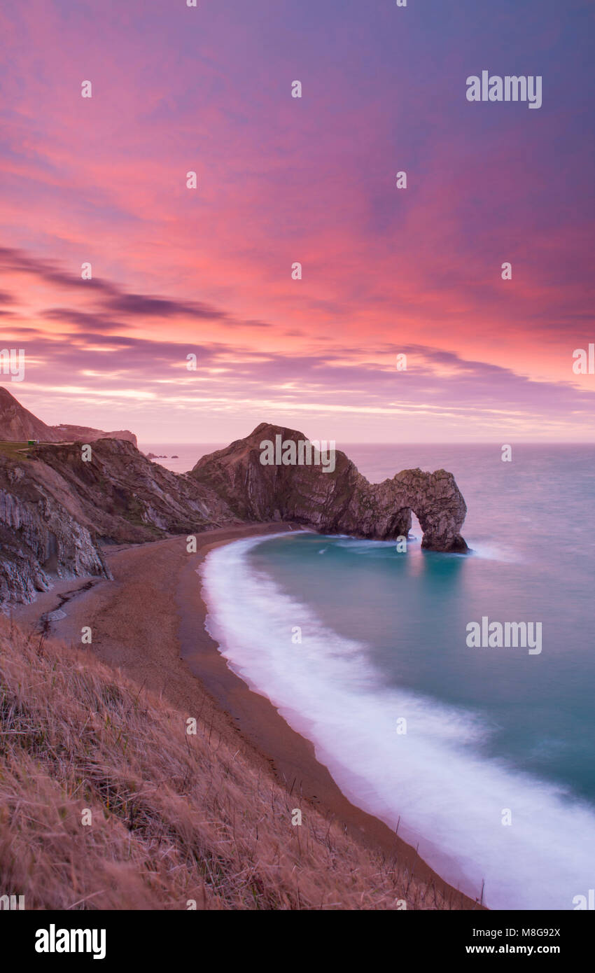 Durdle Door sunrise on the Jurassic coast of Dorset Stock Photo