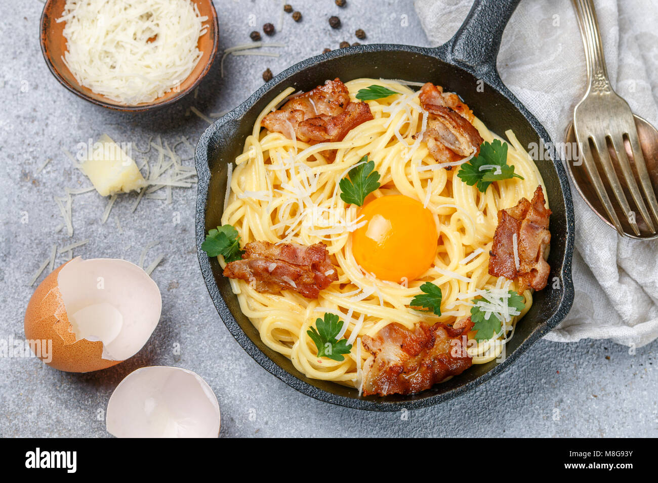 Traditional pasta spaghetti Carbonara with cheese, bacon, parsley and