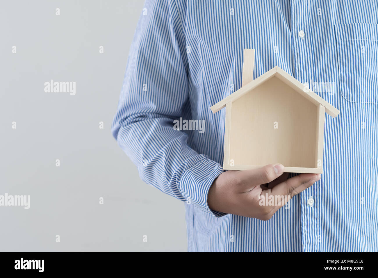 hands holding house homeless housing shelter architecture building