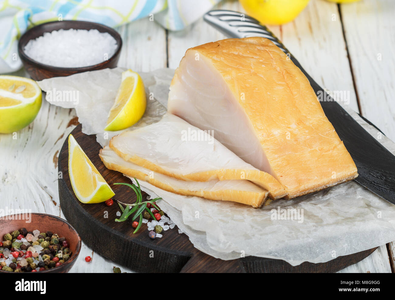 Salted white fish with lemon, rosemary and spices salt and pepper