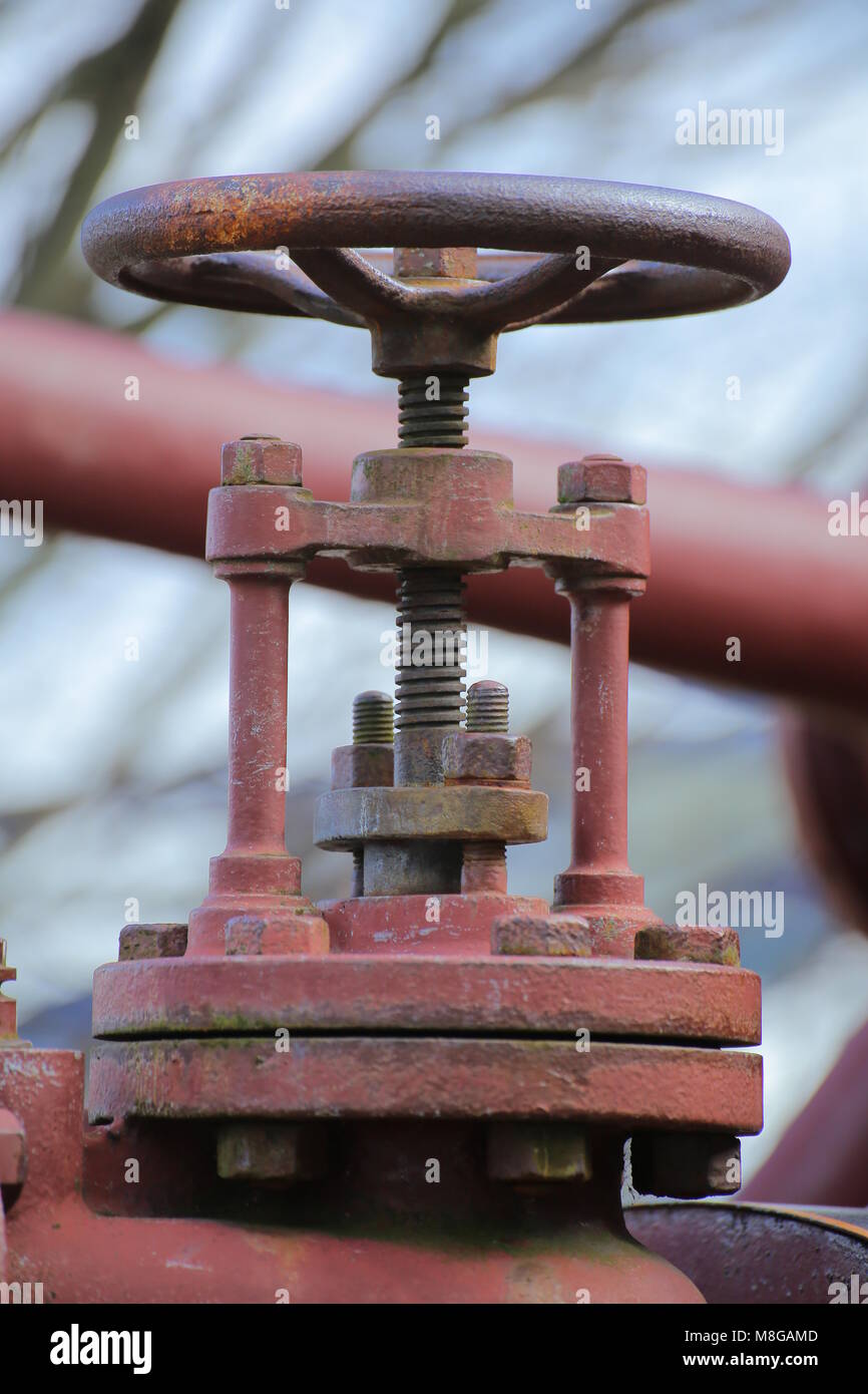 Valve of a historical red steam engine. Stock Photo