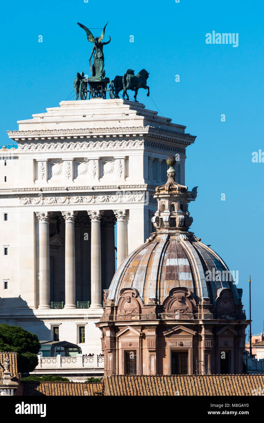 Monument to Vittorio Emanuele II with the dome of the Church of Santi Luca e Martina. Rome. Italy. Stock Photo