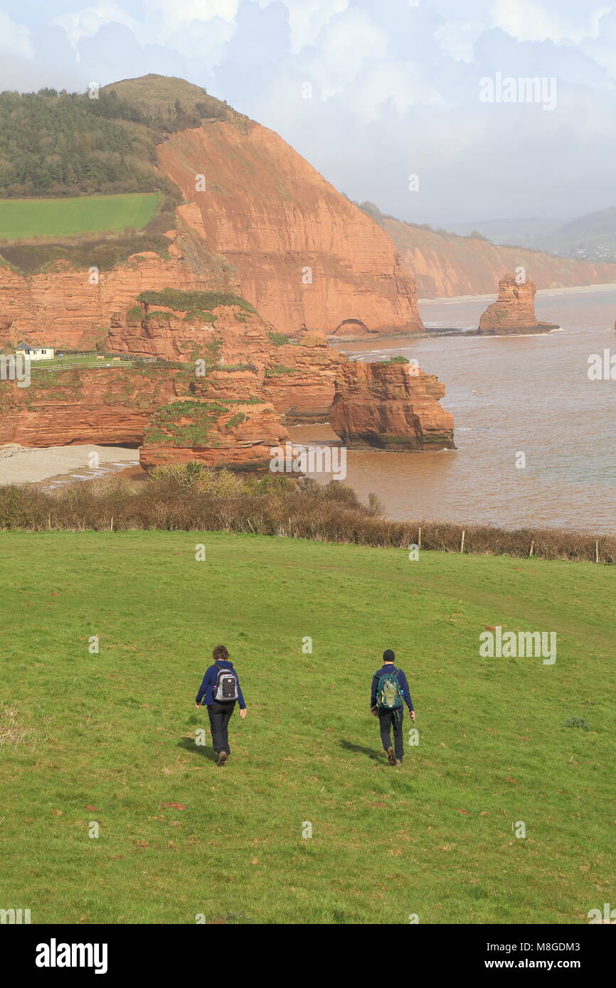 People walk on the South West Coast Path near Ladram Bay in East Devon Stock Photo