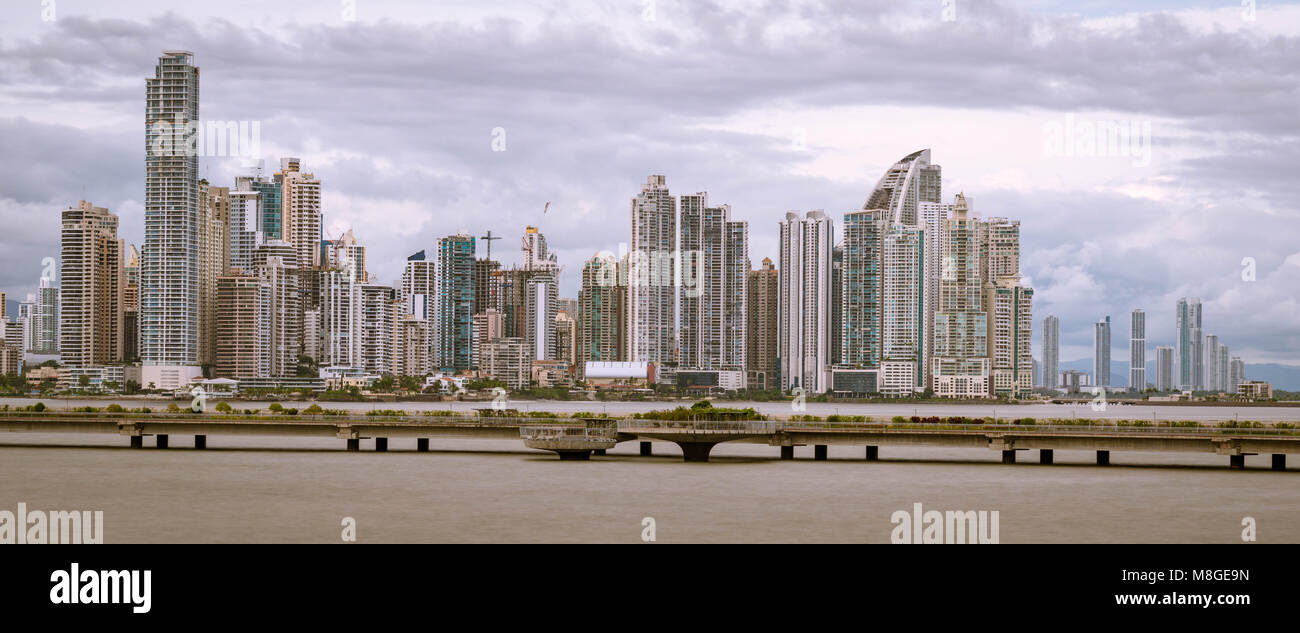 The view of Panama City on a cloudy day, from Casco Viejo, with the Cinta Costera ring in the middle ground Stock Photo