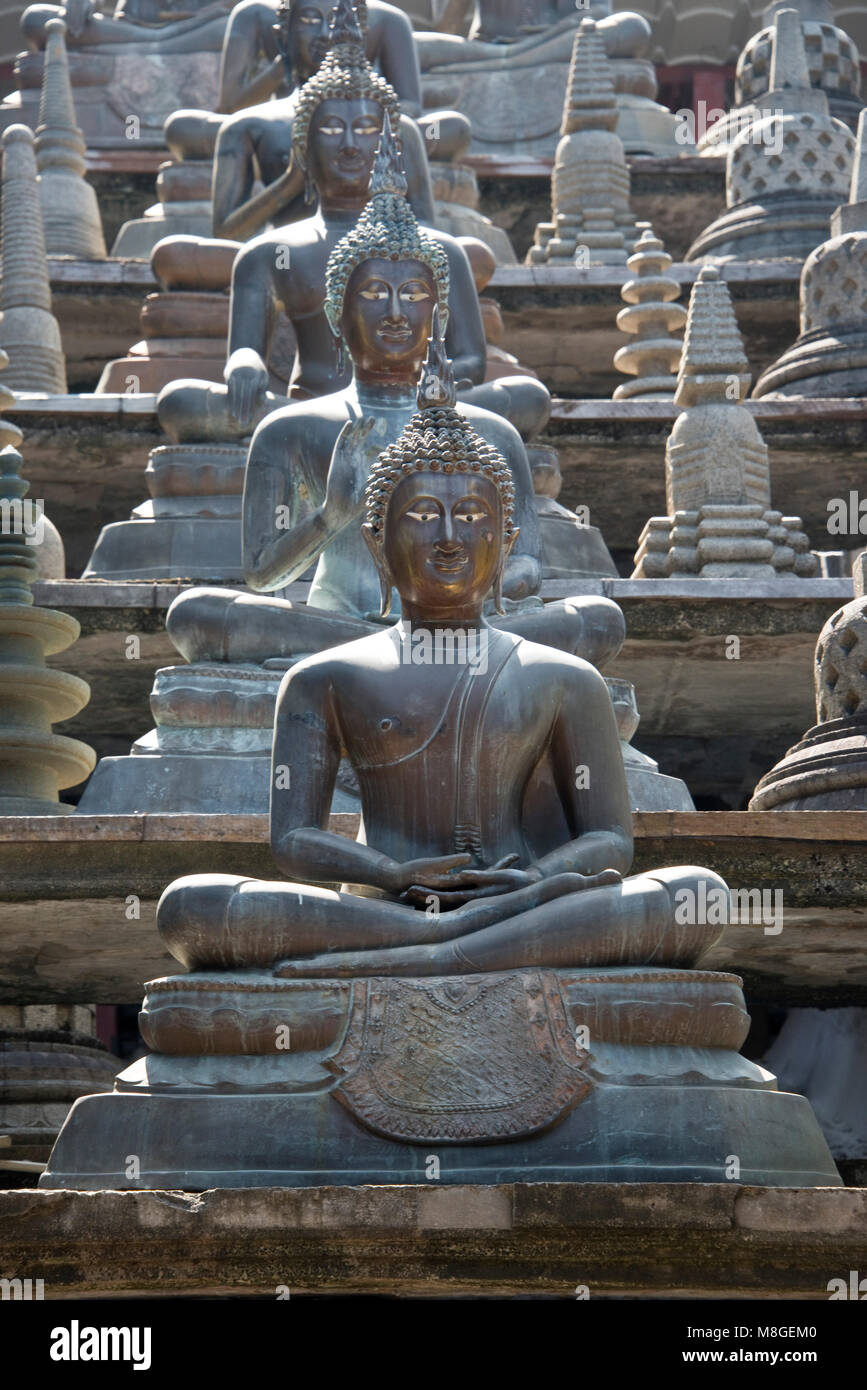 The Borobudur Replica Indonesian Buddha statues at the Gangaramaya (Vihara) Buddhist Temple complex in Colombo, Sri Lanka. Stock Photo