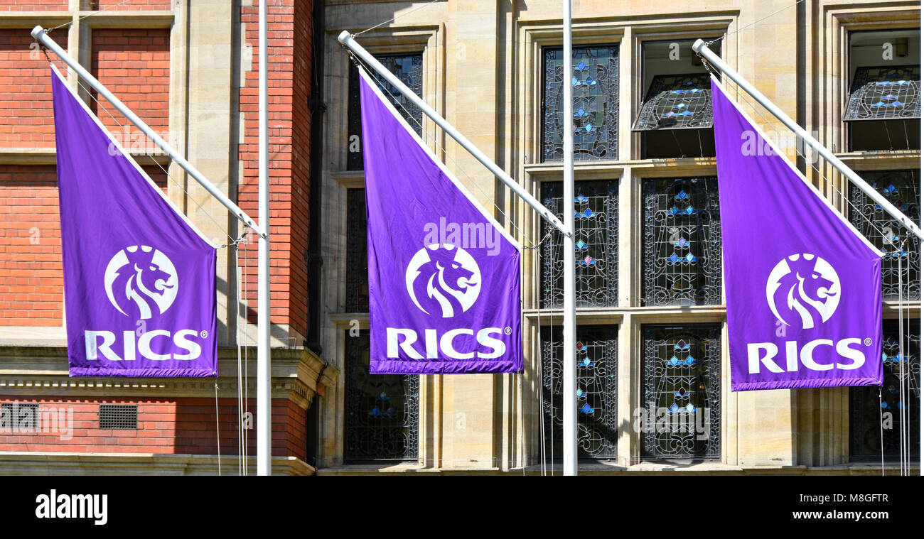 Close up of Royal Institution of Chartered Surveyors RICS logo on flags outside institute headquarters building Parliament Square London England UK Stock Photo