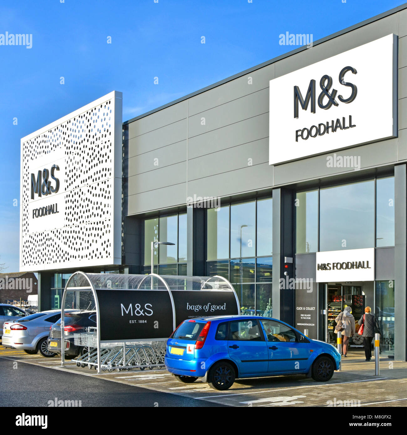 M&S modern architecture of shop front building at Marks and Spencer foodhall in retail park food hall shopping & customer Chelmsford Essex England UK Stock Photo