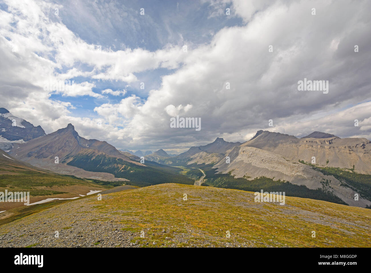 Sun and Clouds above the Alpine Tundra of the Canadian Rockies in Jasper National Park in Alberta, Canada Stock Photo