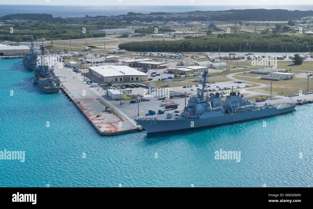 An aerial view of U.S. Naval Base Guam shows several Navy vessels moored in Apra Harbor, March 15. Some of the vessels are in Guam in support of Multi-Sail 2018 and Pacific Partnership 2018. This year also marks the 75th anniversary of the establishment of U.S. 7th Fleet. (U.S. Navy photo by Mass Communication Specialist 3rd Class Alana Langdon) Stock Photo