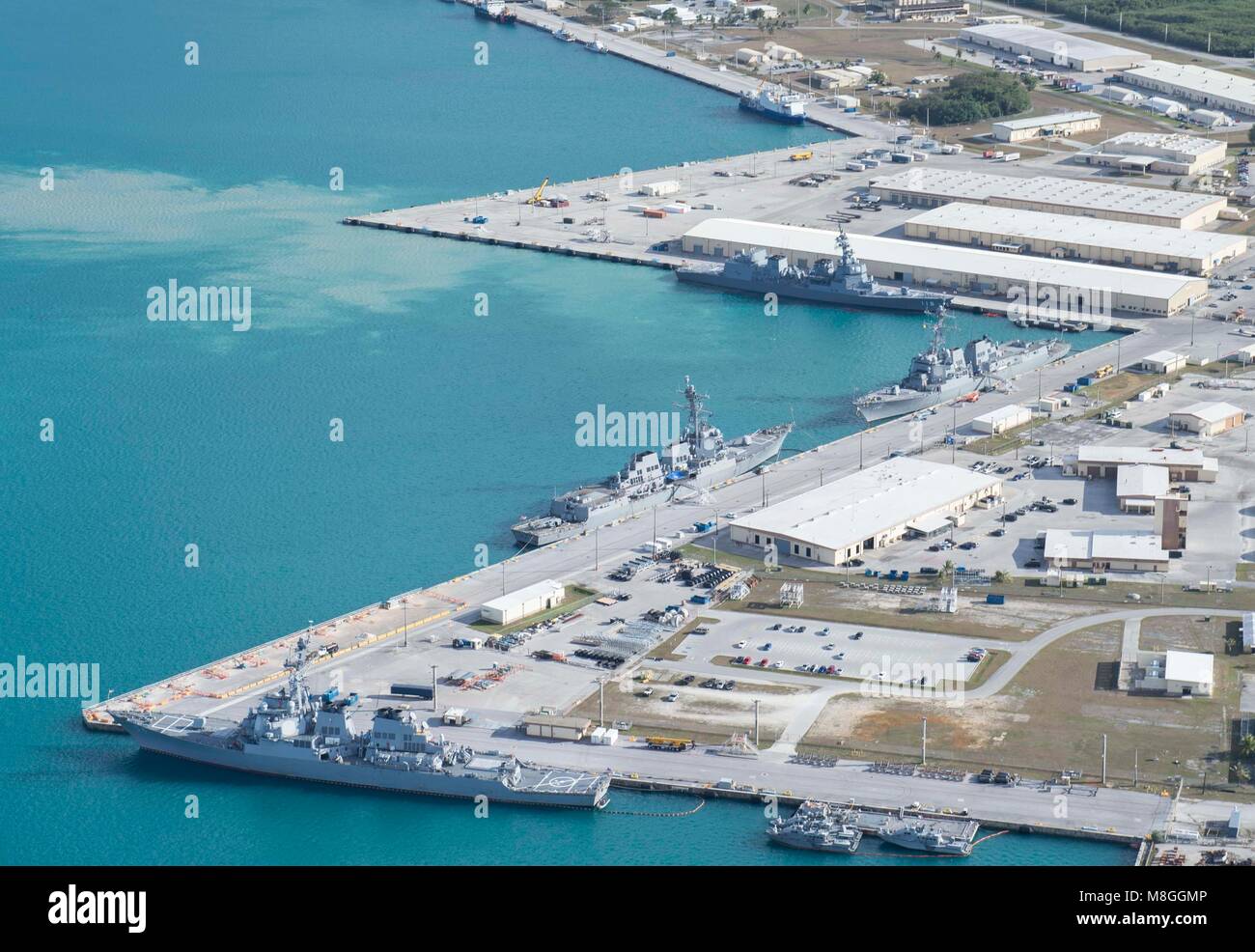An aerial view of U.S. Naval Base Guam shows several Navy vessels moored in Apra Harbor, March 15. Some of the vessels are in Guam in support of Multi-Sail 2018 and Pacific Partnership 2018. This year also marks the 75th anniversary of the establishment of U.S. 7th Fleet. (U.S. Navy photo by Mass Communication Specialist 3rd Class Alana Langdon) Stock Photo
