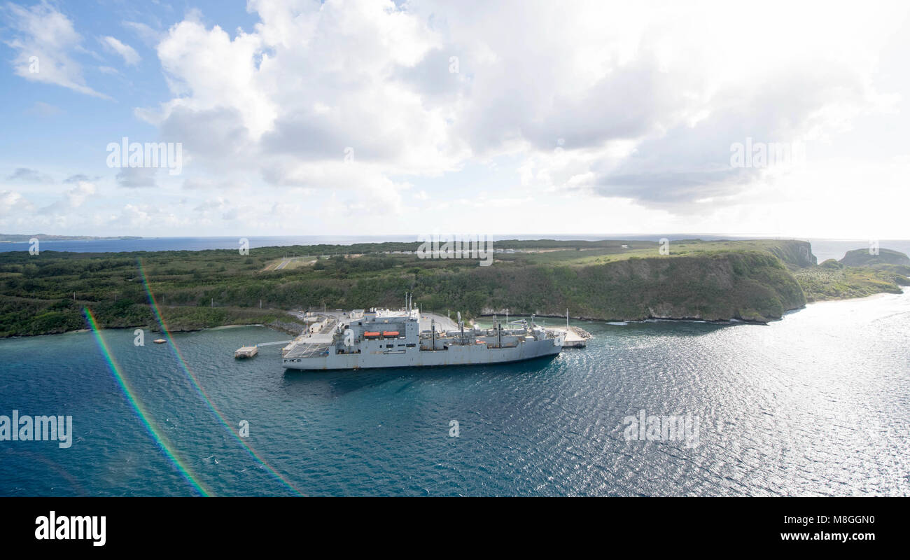 An aerial view of U.S. Naval Base Guam shows dry cargo and ammunition ship USNS Wally Schirra (T-AKE 8) moored in Apra Harbor, March 15. Multiple vessels are in Guam in support of Multi-Sail 2018 and Pacific Partnership 2018. This year also marks the 75th anniversary of the establishment of U.S. 7th Fleet. (U.S. Navy Combat Camera photo by Mass Communication Specialist 1st Class Stacy D. Laseter) Stock Photo