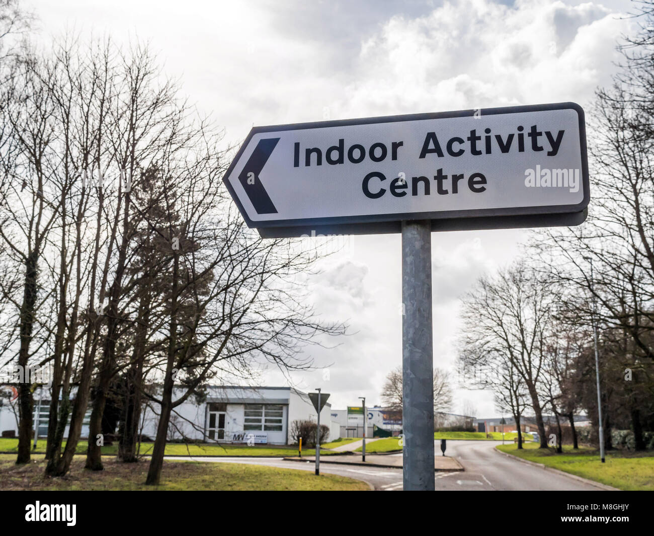 Day view Indoor Activity Centre directional road sign post on british