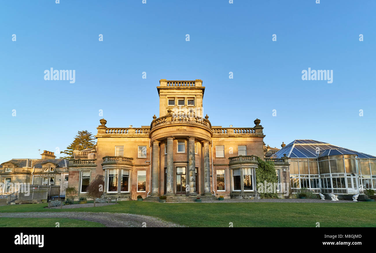 The Evening Winter light reflecting on the walls of Letham Grange manor ...