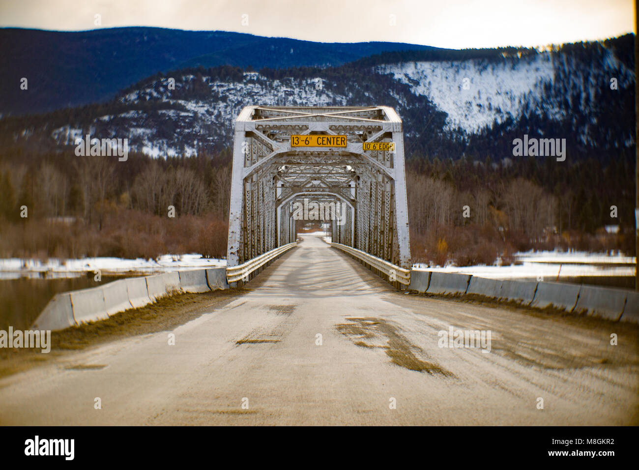 The one lane steel bridge over the Clark Fork River, at Noxon, in Sanders County, Montana. Stock Photo
