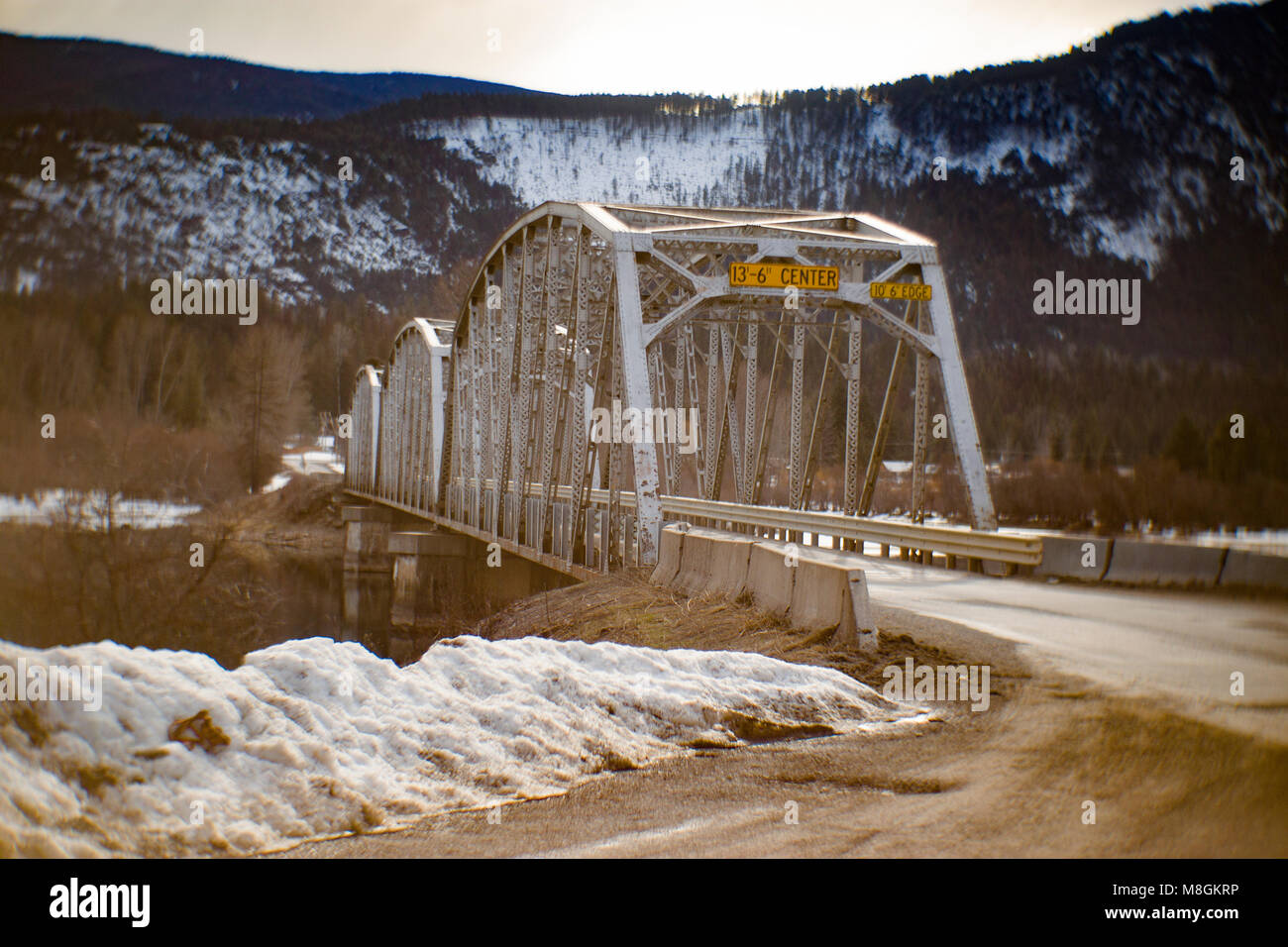 The one lane steel bridge over the Clark Fork River, at Noxon, in Sanders County, Montana. Stock Photo