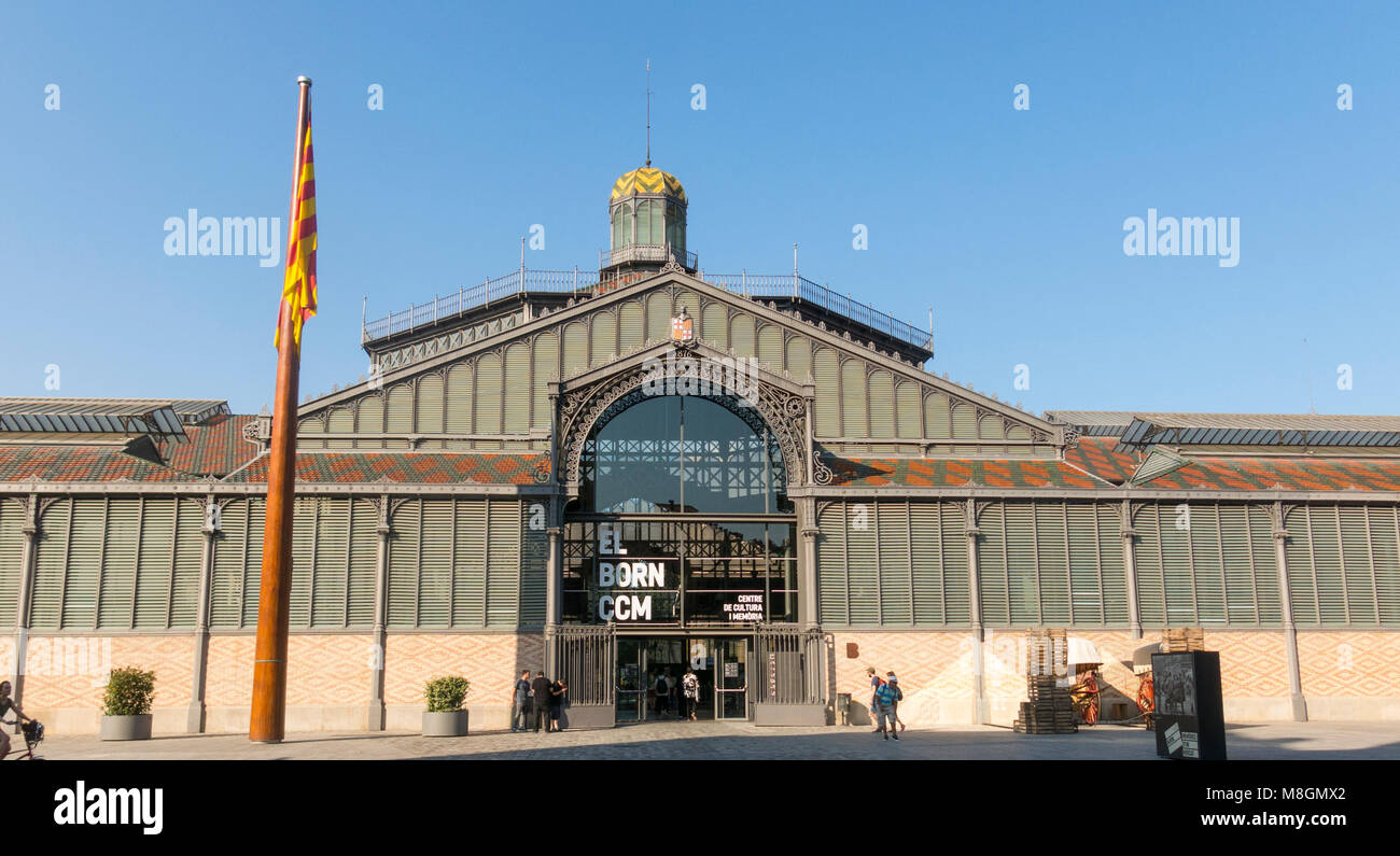 The facade of Born market, and flag of Catalonia. It is an example of iron architecture, a movement within the modernist. Born district. Barcelona Stock Photo