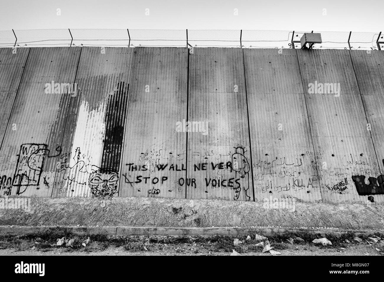 Israeli separation wall. The barrier laid the groundwork for the de-facto annexation of most settlements and much land for their future expansion. Stock Photo