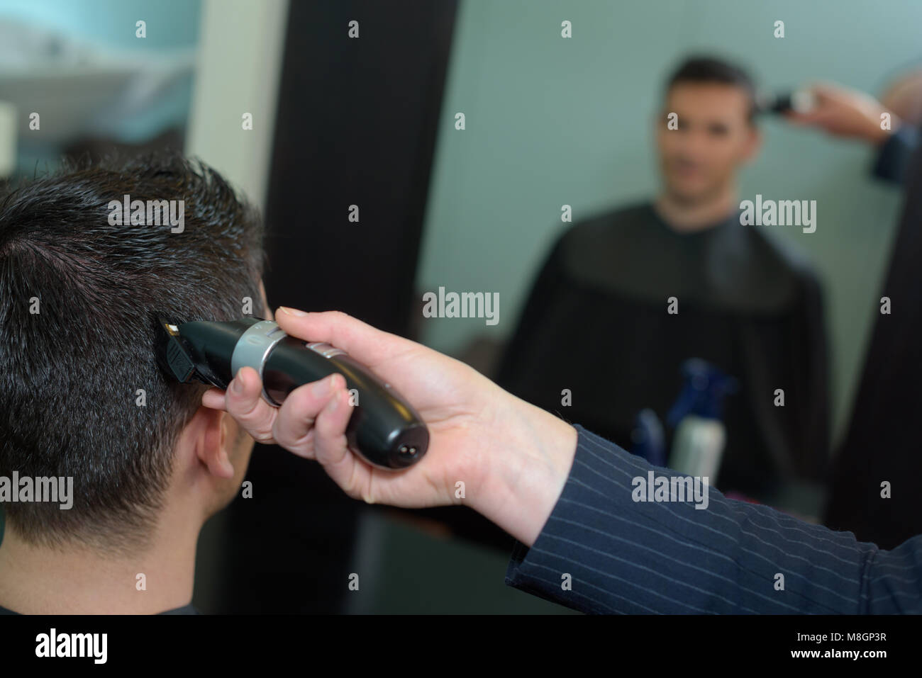 rear view of young man having hair cut Stock Photo - Alamy
