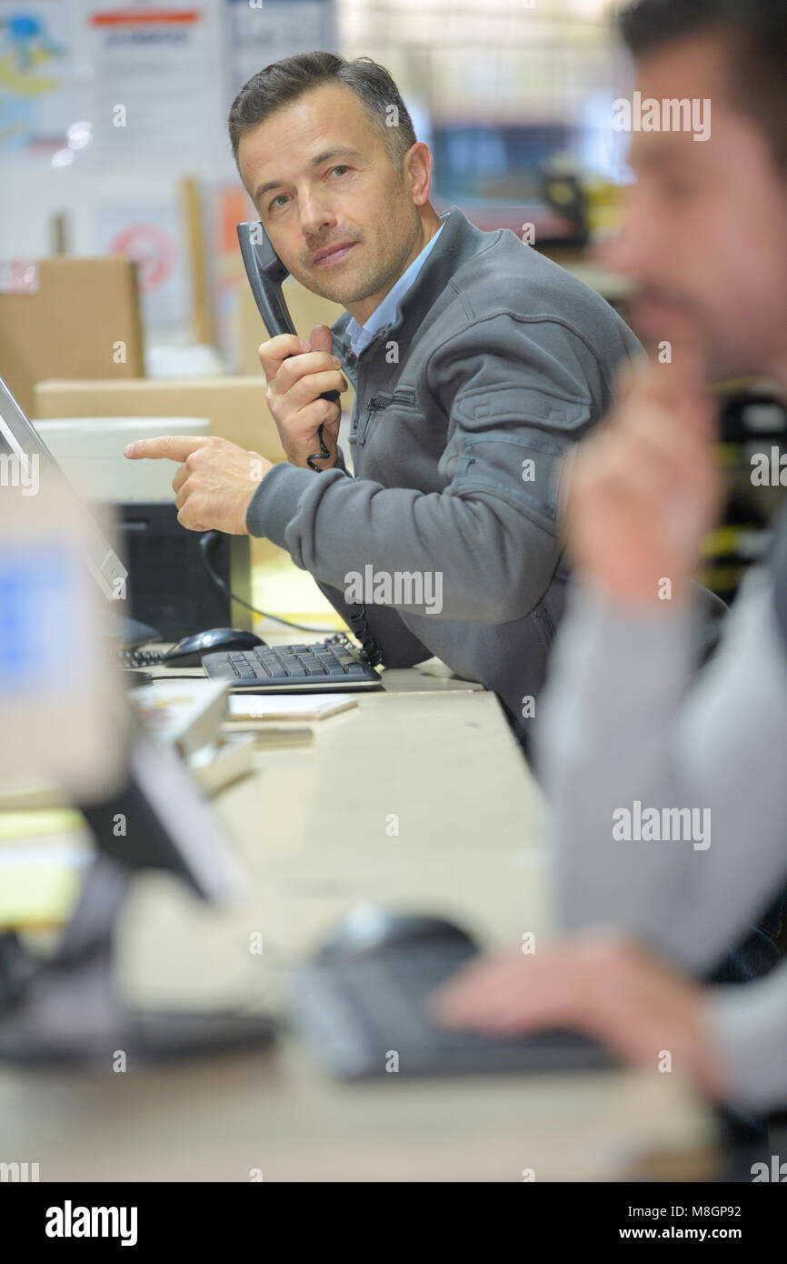 Elegant young office worker speak hi-res stock photography and images ...