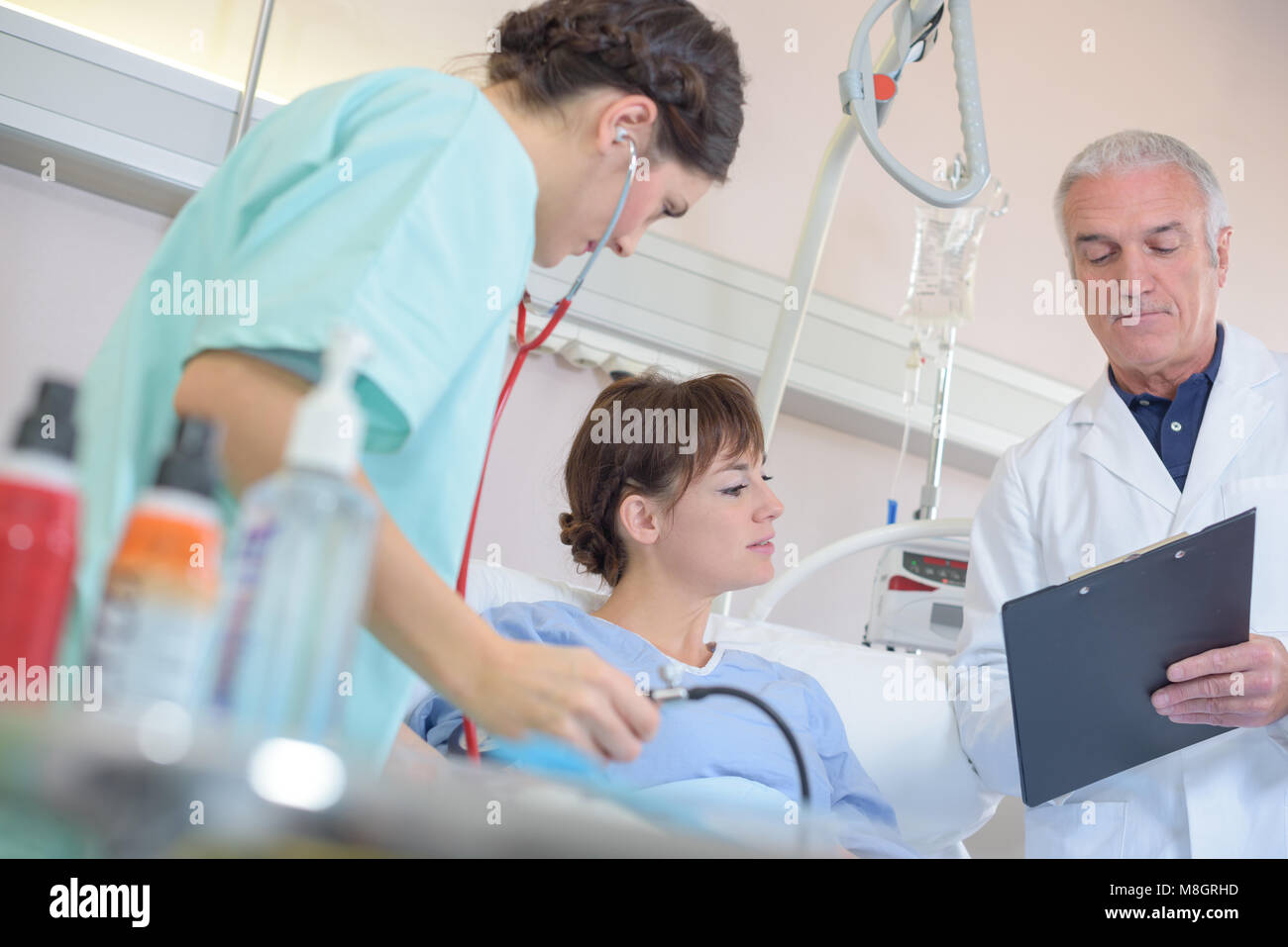 Medical staff with patient in hospital bed Stock Photo Alamy