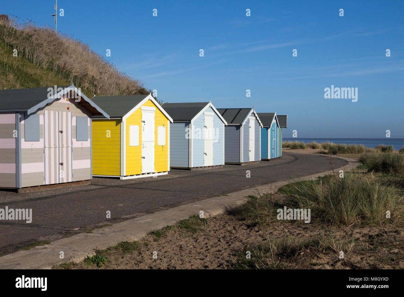 Beach Huts At Pakefield Suffolk England Against A Blue Sky