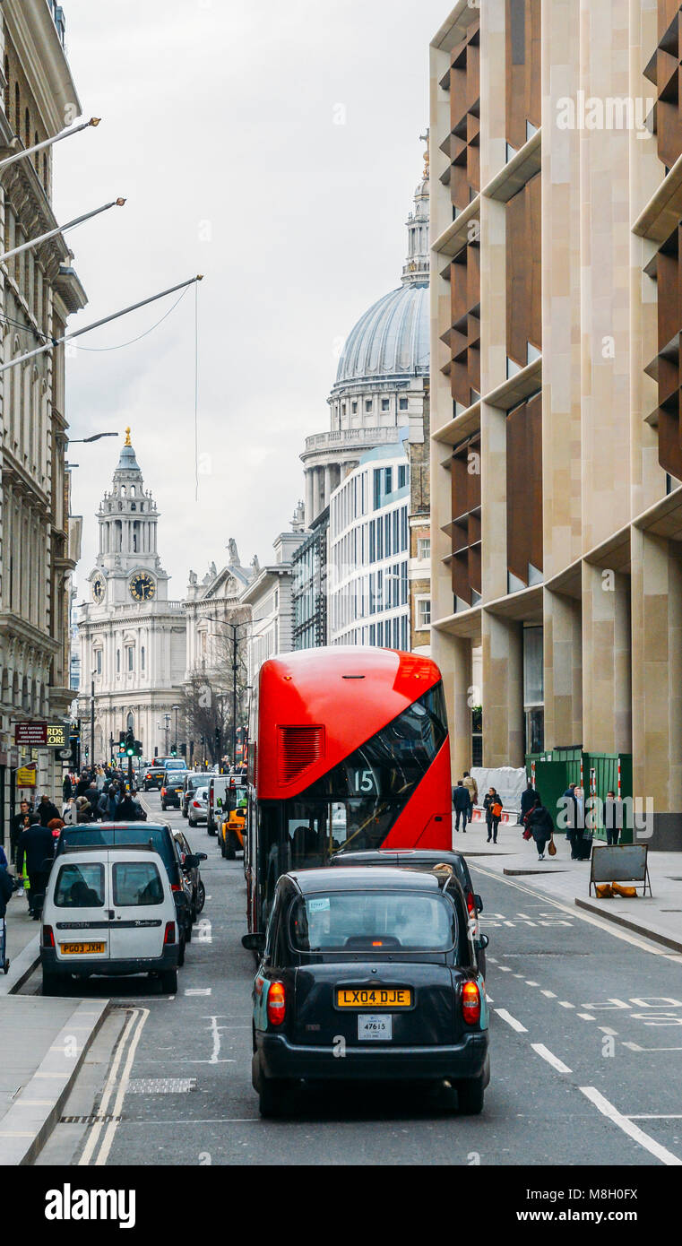 Heritage red Routemaster Bus operating in the City of London. Open platform at back facilitated speedy boarding Stock Photo