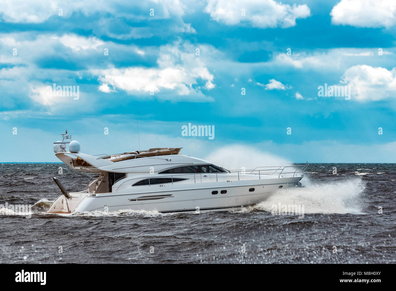 White speed boat moving fast to the Baltic sea. Water sport Stock Photo ...