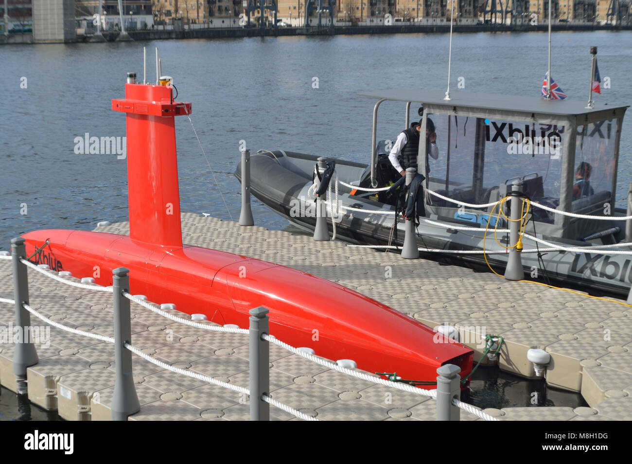 iXblue DriX unmanned surface vessel doing demonstration runs in London's Royal Docks as part of the Oceanology International 2018 exhibition Stock Photo