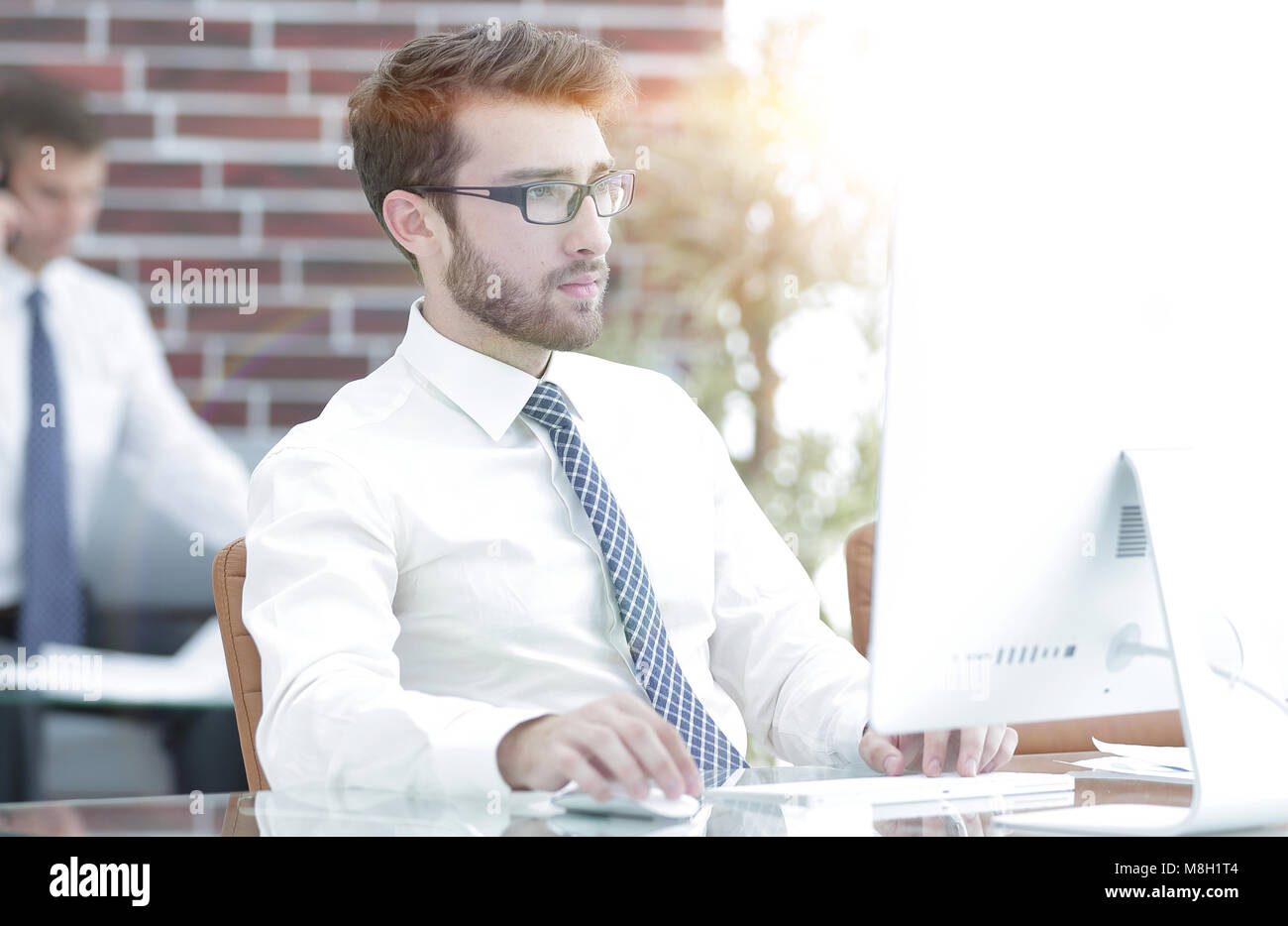 Manager works on a computer Stock Photo - Alamy