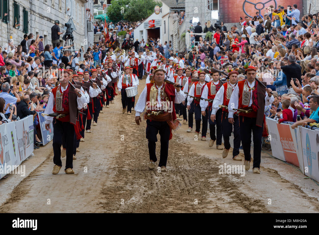 Alkar's squire marchin to the beat of drum during Alka tournament in town Sinj, Croatia Stock Photo