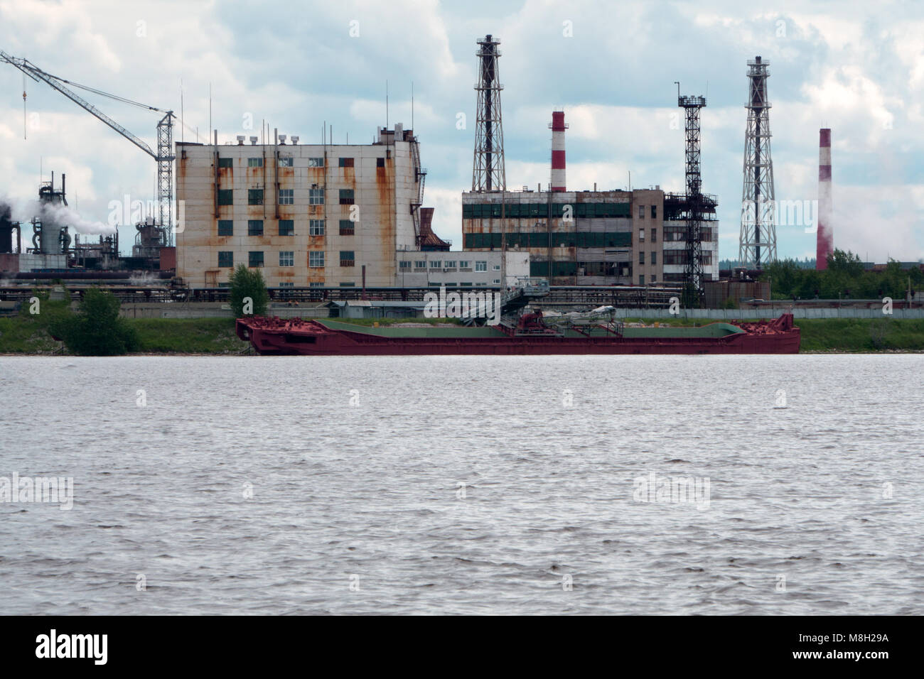 Cargo ship for sea transport.Large cargo ship.Large cargo ships parked in the river.Transshipment vessel Stock Photo