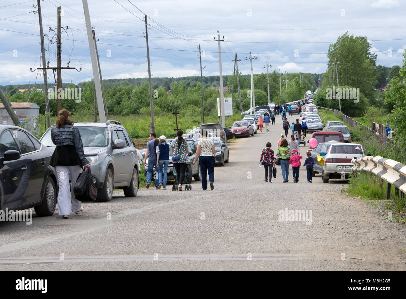 melting pot people crossing the street before sunset. Park and a two