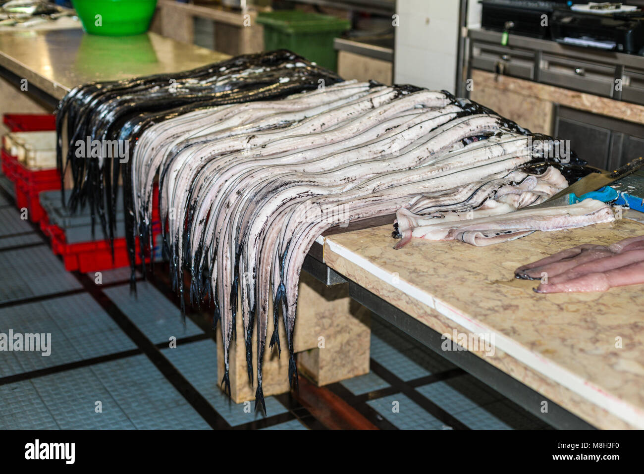 Atlantic largehead hairtail or beltfish (also called espada in Portuguese) on traditional fish market Mercado dos Lavradores in Funchal, Madeira islan Stock Photo