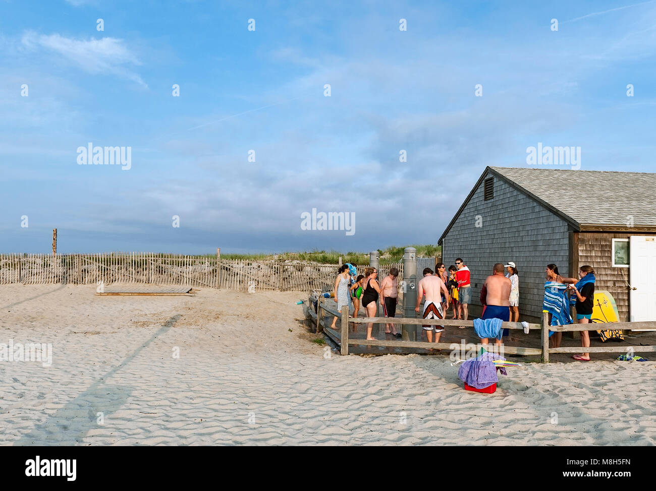 Vacationers wash off sand in outdoor beach showers, Nauset Beach, Cape